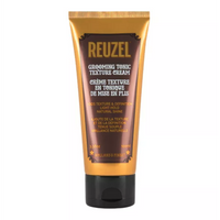Reuzel Grooming Tonic Texture Cream - vooraanzicht goudbruine tube op witte achtergrond